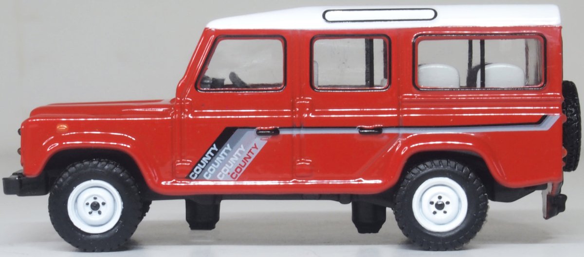 Oxford Diecast 76DEF018 Land Rover Defender LWB St. Wagon Masai Red - 1:76 Scale - Phillips Hobbies
